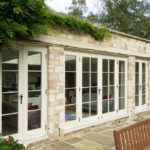 cream wooden french patio doors with grid