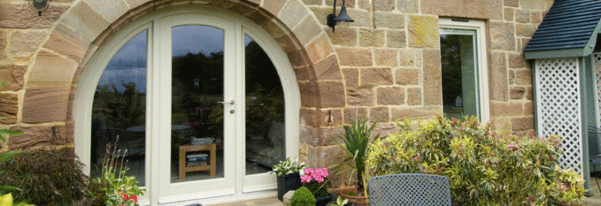 cream wooden cottage doors with archway
