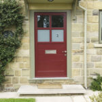 red wooden front door with frosted glass